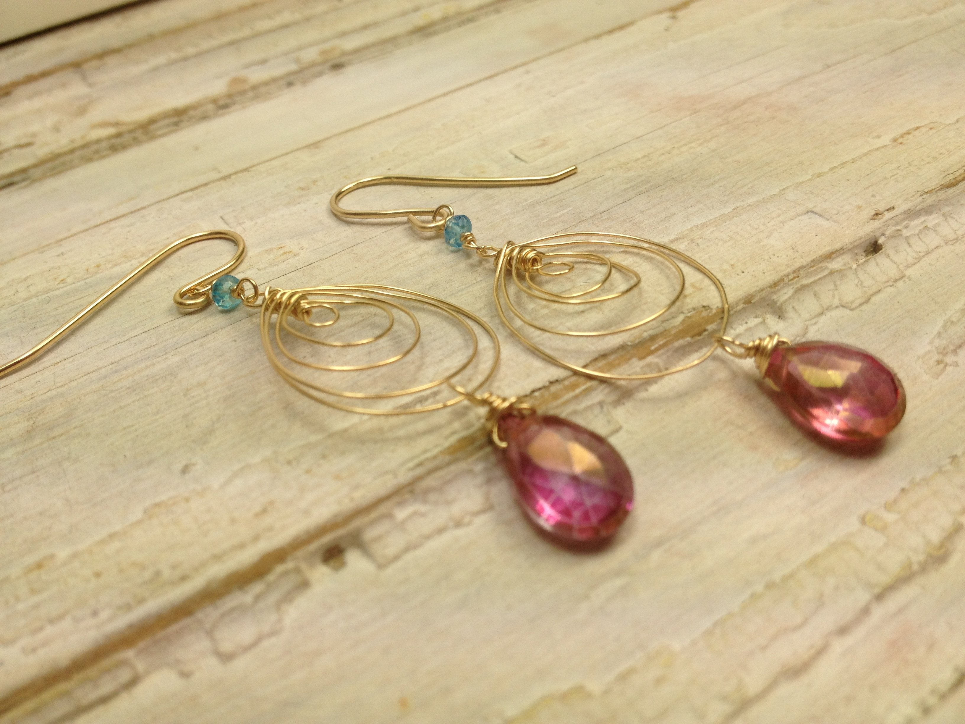 gold earrings beautiful pink gem spiral 