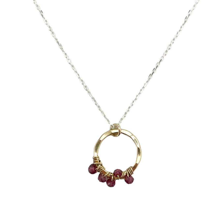 gold-filled and sterling silver circle necklace with rhodolite garnet wrap